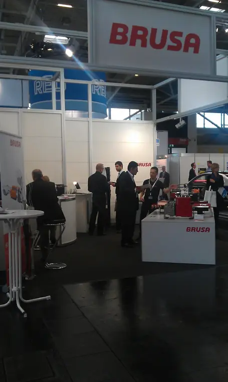 BRUSA trade fair stand with chargers and conversations