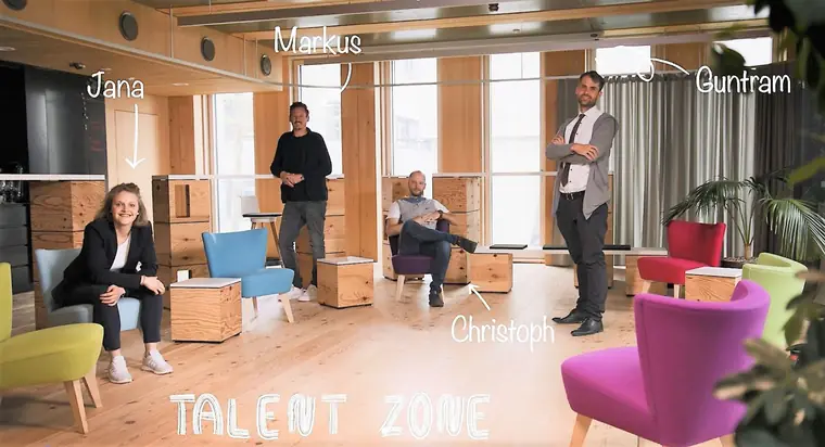 The Talent Zone team in a room with timber furniture